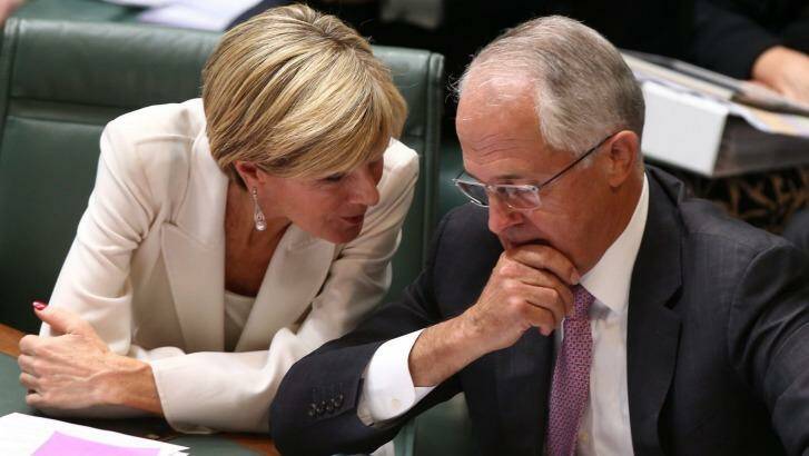 Foreign Affairs minister Julie Bishop and Prime Minister Malcolm Turnbull confer during question time on Monday. Photo: Andrew Meares