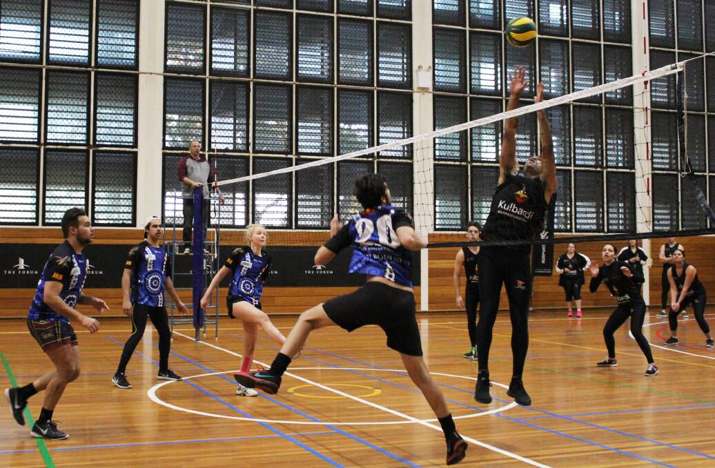 ON THE BALL: Melbourne University (blue) takes on Murdoch University (black) in the volleyball final of the National Indigenous Tertiary Student Games.