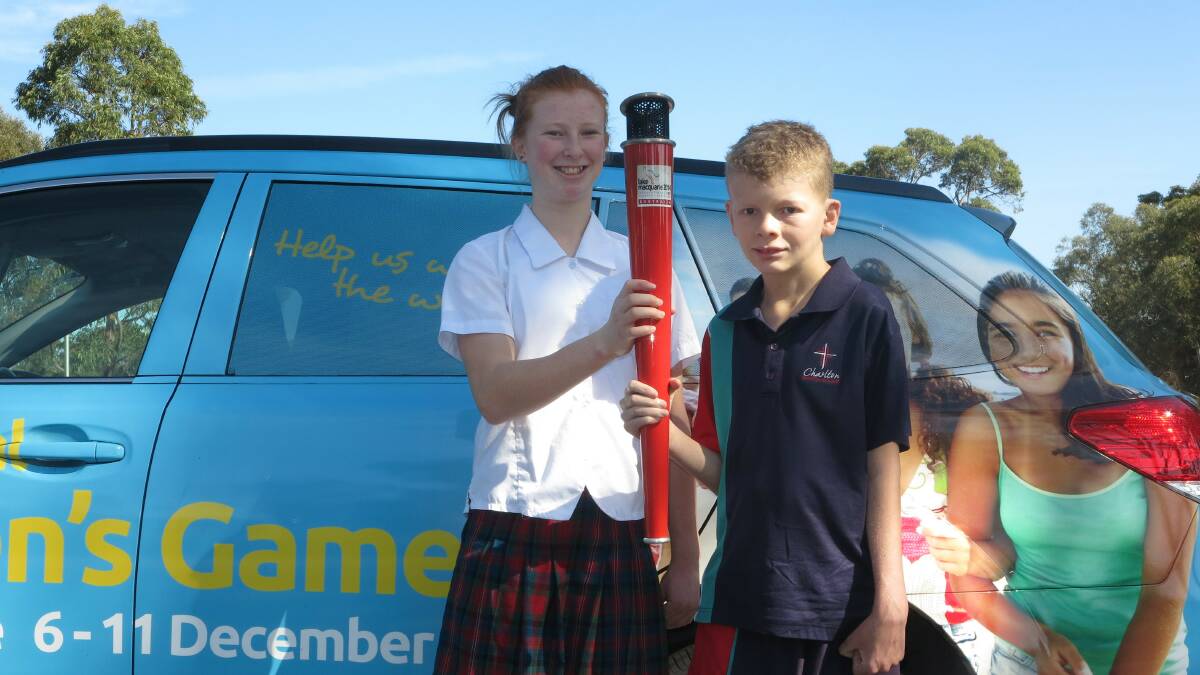 Charlton Christian College students Claudia Martin and Nicholas Goodwin prepare for the 2014 International Children's Games School Torch Relay.