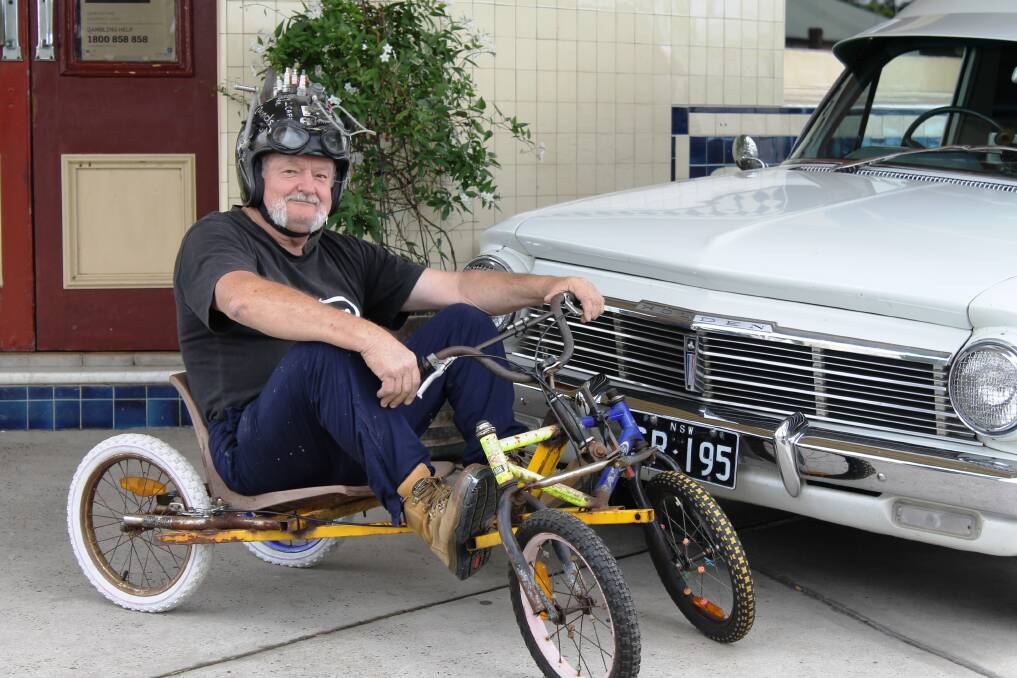 Glenn Redman, of Barnsley, shows off his billy cart and classic car.
