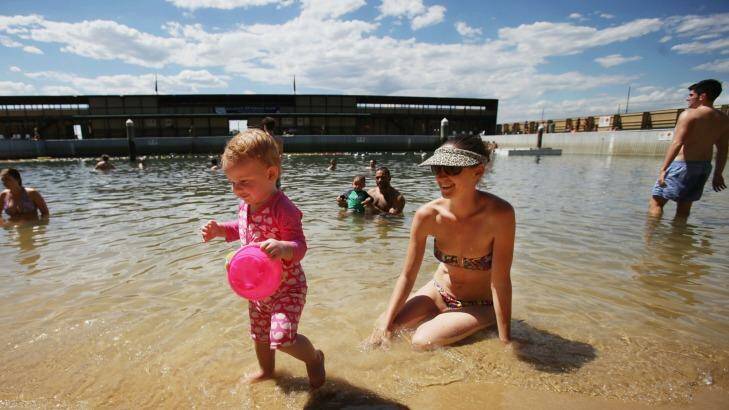 Laura Barnes and daughter Isabelle, 15 months, cool off at Dawn Fraser Baths. Photo: Fiona Moris