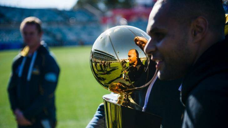 Patrick "Patty" Mills at Canberra Stadium with the NBA trophy last year. Photo: Rohan Thomson