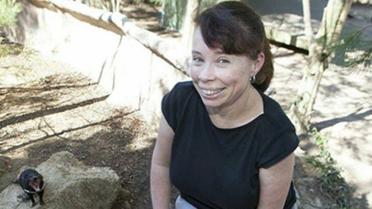 Dr Janine Deakin and tumour-prone friend, a Tasmanian devil.