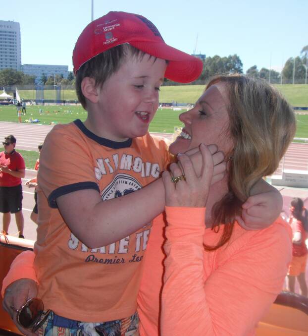 Riley Hawke and his mother Leeanne at an athletics carnival for children with autism.
