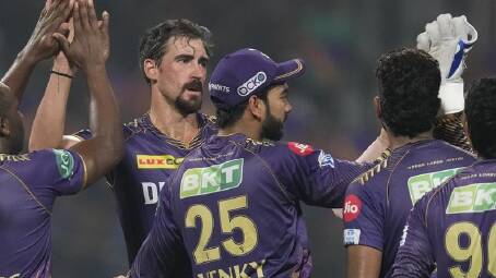 Mitchell Starc is congratulated by his Kolkata teammates for dismissing Jake Fraser-McGurk. (AP PHOTO)
