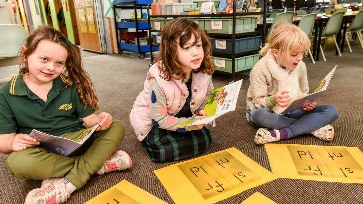 Primary school students learning to read using phonic sounds. Photo: Justin McManus