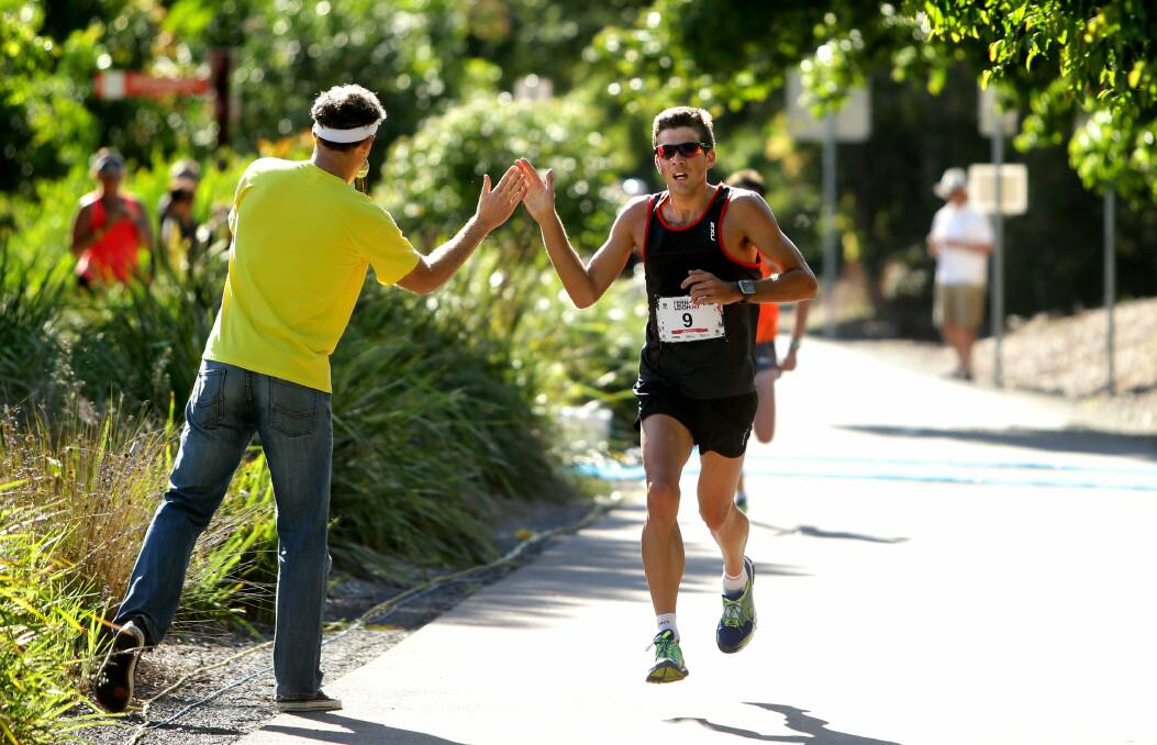 RIGHT STUFF: Triathlete Aaron Royle crosses the finish line at last year’s Lake Macquarie Fernleigh 15.