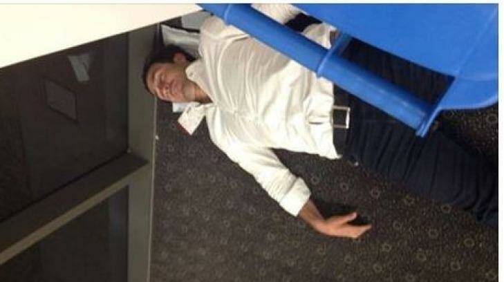 Bad form: The Facebook post of Andrew Johns asleep in Toowoomba Airport.
 Photo: Facebook / Helen Wright