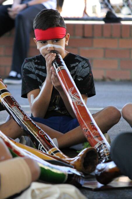 ON SONG: Tyrese Gordon performs as part of Wallsend Public School's NAIDOC Week celebrations.