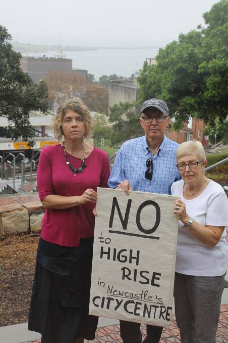 NO WAY: Newcastle Inner City Residents Alliance members Daniela Heil, Brian Ladd and Gael Davies say the view behind and the city's historic character would be lost if building heights are increased. Picture: Kim-Cherie Davidson