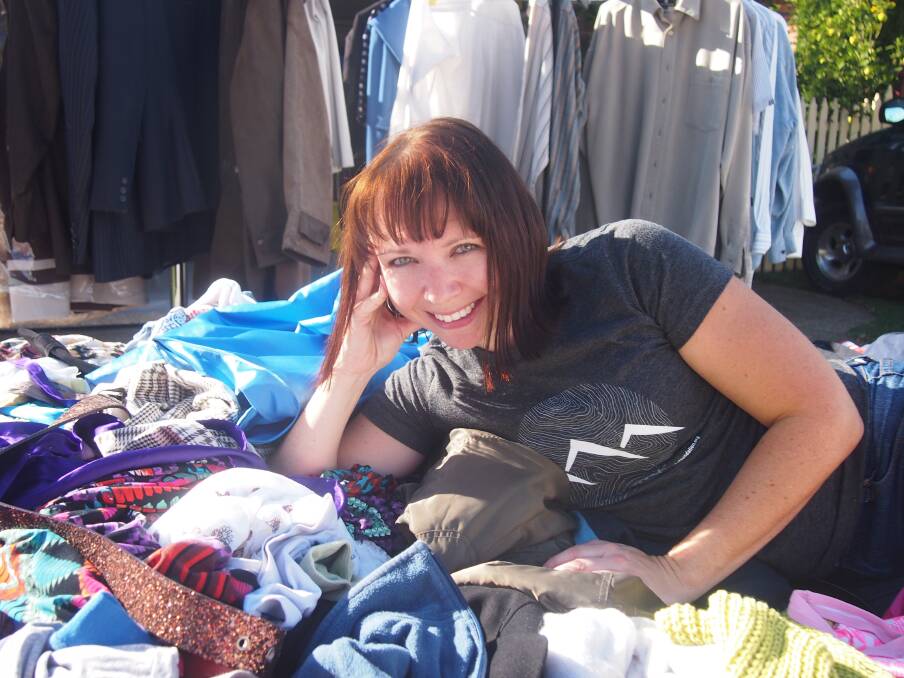 BARGAINS: Melinda Lee Harvey with clothes donated for Rags 2 Riches by friends, family and work colleagues.