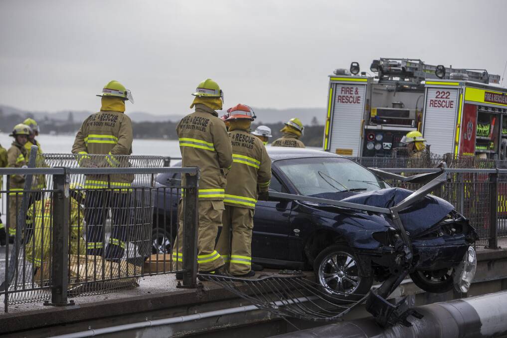 Swansea and Belmont fire crews respond to a car accident on the Swansea bridge amid the NSW Firefighter Championships.