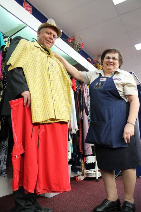 COLOURFUL: Salvos Store Hunter area manager Harold Cleveringa and Charlestown manager Janice Hilzinger try on some of the clothes.