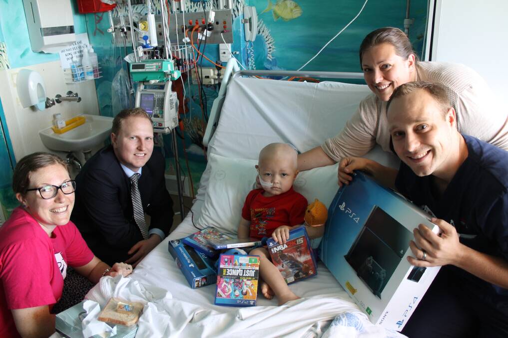 Cara Dahl, from Camp Quality, Craig Tye, from The Greater, Aiden Jelenic (aged 2), from Edgeworth, with his mother Sharon Jelenic and nurse Tyler from the John Hunter Children's Hospital.