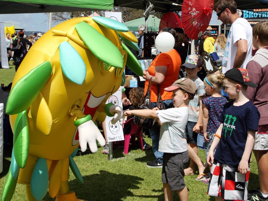 CLEVER: Children meet Community First Credit Union's mascot at the Living Smart Festival which featured organic food, solar power, weed control and much more.