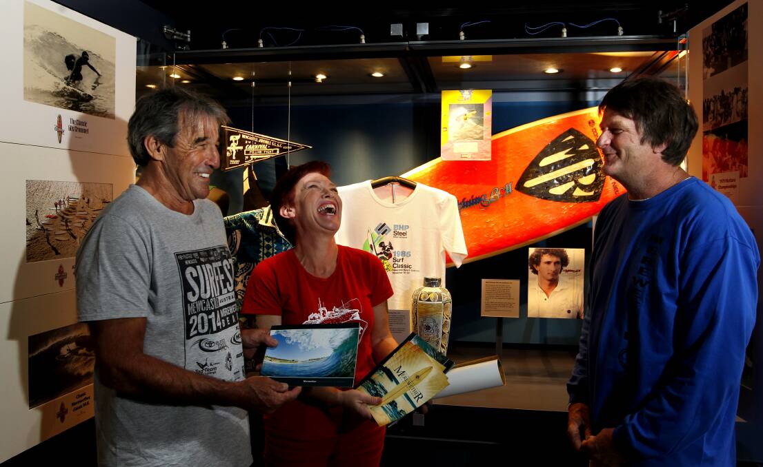 Surfest is launching an appeal for old photos to celebrate 30 years of Surfest which will be part of an exhibition at Newcastle Museum. From left Warren Smith and Deputy Director at Newcastle Museum Julie Baird with Dave Anderson President of Merewether Surfboard Club who came forward today with images to kick start the appeal. They are seeking images from 2000-2010 of Surfest and Newcastle's surfing culture.