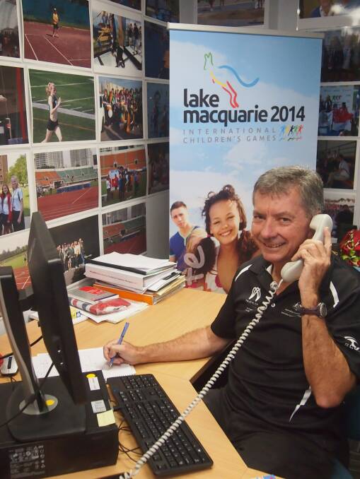 Lake Macquarie International Children's Games volunteer Dave Williams works on the scoping at the event office.