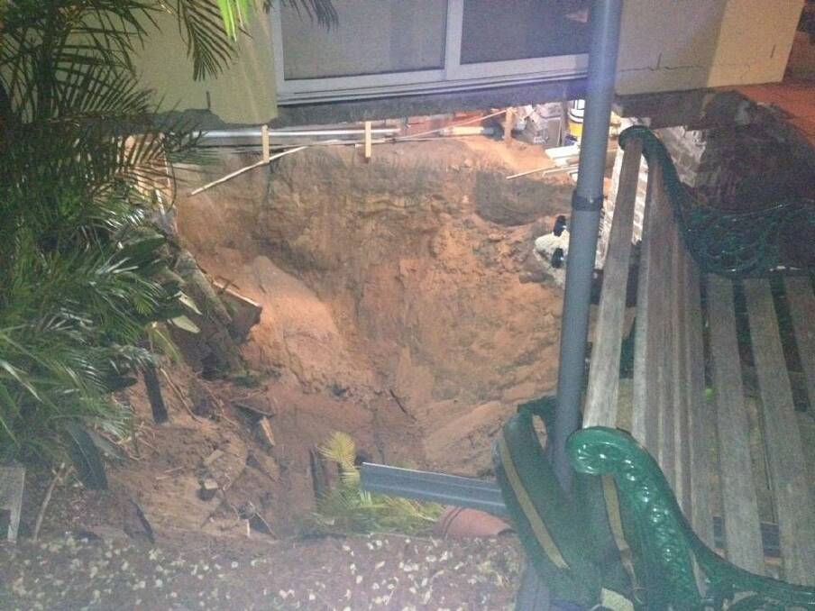 Sinkhole under the first house in Lambton Parade, Swansea.