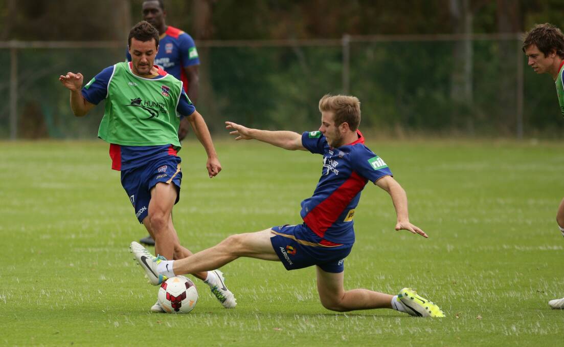 NCH - SPORT - Newcastle Jets training at Ray Watt Oval Callaghan - Andrew Hoole stretching himself -- 5th Nov  2013 Pic by  Peter Stoop