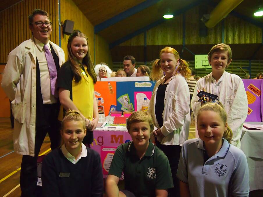 YOUNG THINKERS: Swansea High School head science teacher Paul Nebauer leads a group of primary students at the Galgabba Learning Community's science fair.