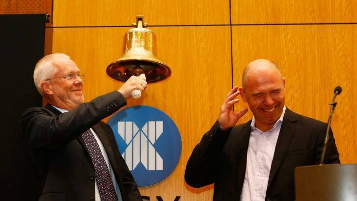 MYOB chairman Justin Milne and CEO Tim Reed ring the bell at the start of trading in MYOB at the ASX. Photo: Daniel Munoz