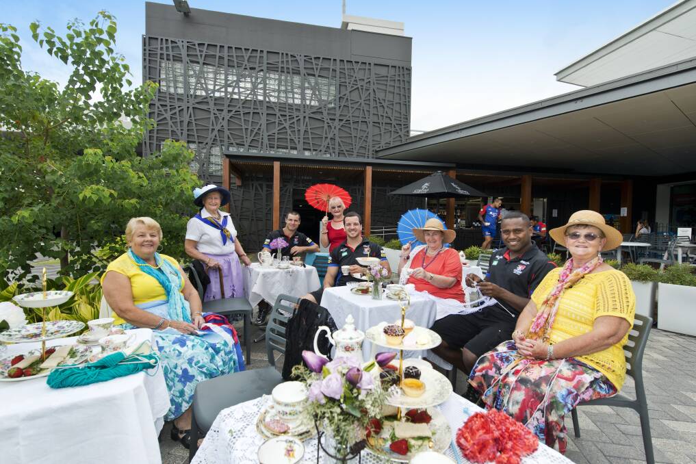 Knights Nannas with some of the players - Wendy Hepplewhite, Margaret Chandler, James McManus, Elaine Roberts, Jarrod Mullen, Carol Johnson, Akuila Uate and Joan Delaforce - in a publicity shot for Australia's Biggest Morning Tea in the Hunter.