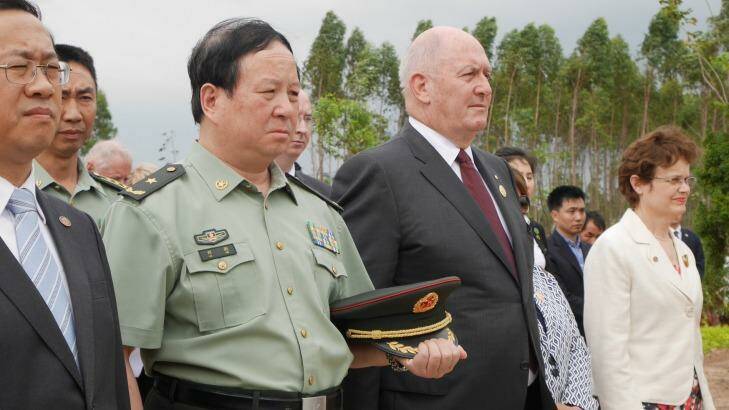Governor General Peter Cosgrove paying respects at the Gull Forces war graves at Lao'ou, Hainan island in southern China, alongside People's Liberation Army general Liu Xin.  Photo: Philip Wen