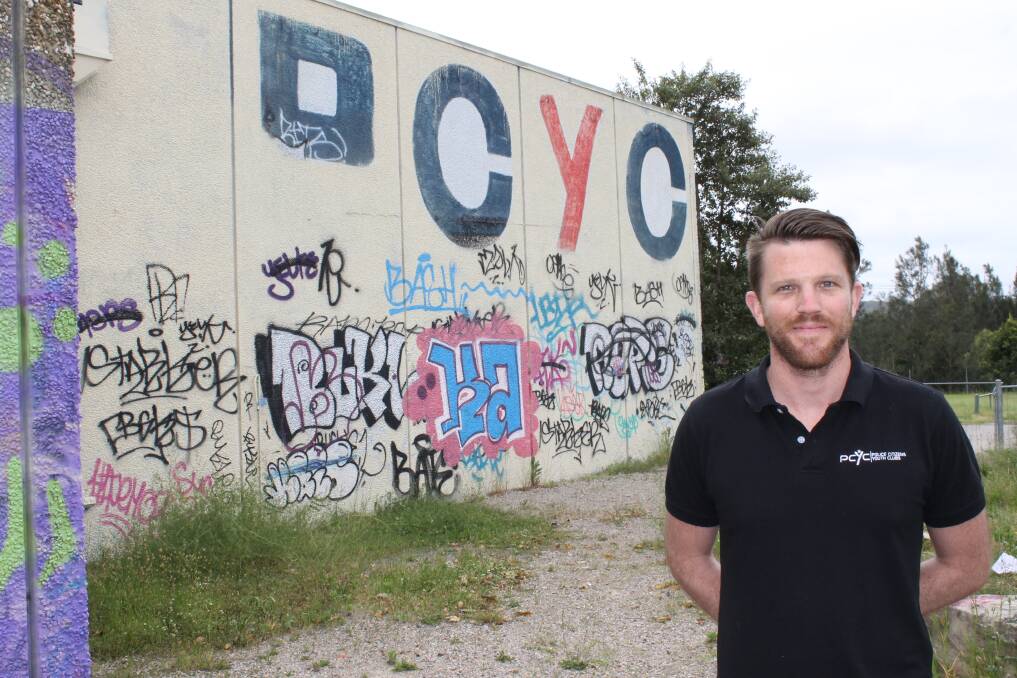 TARGETED: Lake Macquarie PCYC manager Andrew Best with some of the graffiti vandalism.