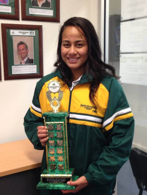 Netballer Tiueti Holland with the Hunter Academy of Sport's Saxon White trophy for most outsanding female athlete.