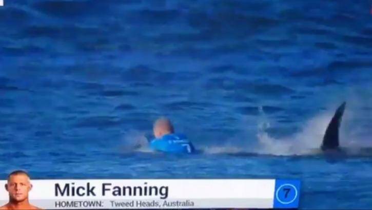 The moment a huge shark launches at Australian surfer Mick Fanning, who escaped without injury after he "punched him in the back".  Photo: Fox Sports