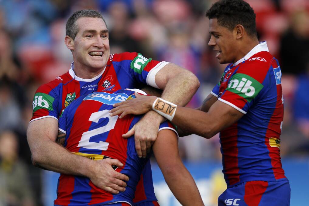 SLAP HAPPY: Chris Houston and Dane Gagai celebrate with Chanel Mata'utia after he scored one of three tries.