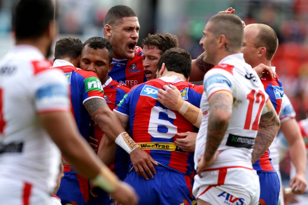 JUBILANT: Knights players celebrate after a Jarrod Mullen try.