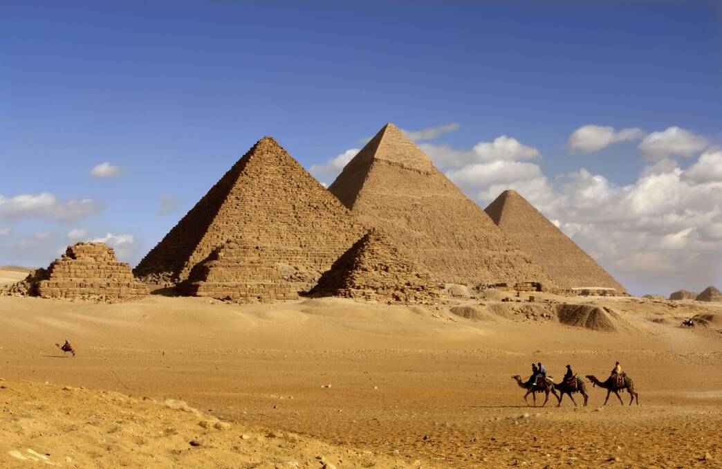 Pyramids, Giza, Egypt. Photograph by istock. SHD TRAVEL DEC 19.  Egypt, Pyramid, Cairo, Giza, Ancient Egyptian, Traditionally Egyptian, Camel, Desert, North Africa, Bedouin