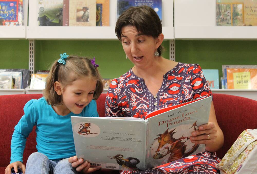 WORDS-WORTH: 2013 Lake Macquarie Summer Reading Program winner Amy Disher, 5, and her mother Zoe read a book at Charlestown library.