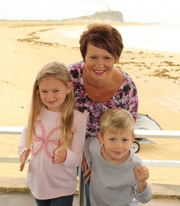 Zoe Russell,7, of Macquarie Hills with her mum Michelle and brother Zac, 5.