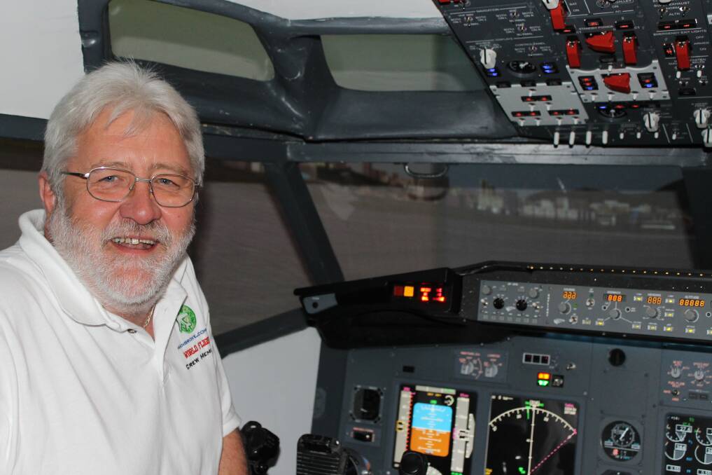 PASSION: Tony Ralph of Caves Beach in his self-made flight simulator.