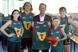 League CEO Andrew Dillon (centre) at the launch of the AFL's 19th team, the Tasmania Devils. (HANDOUT/SOLSTICE DIGITAL)