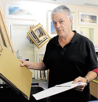 PAPER PAIN: Cardiff Chamber of Commerce president Greg Foster recycles cardboard at his Kelton Street framing shop.