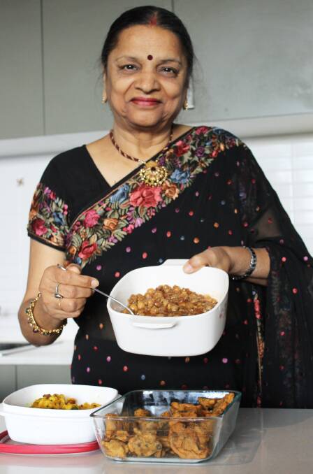 Charlestown resident Promila Gupta prepares some traditional Indian food.