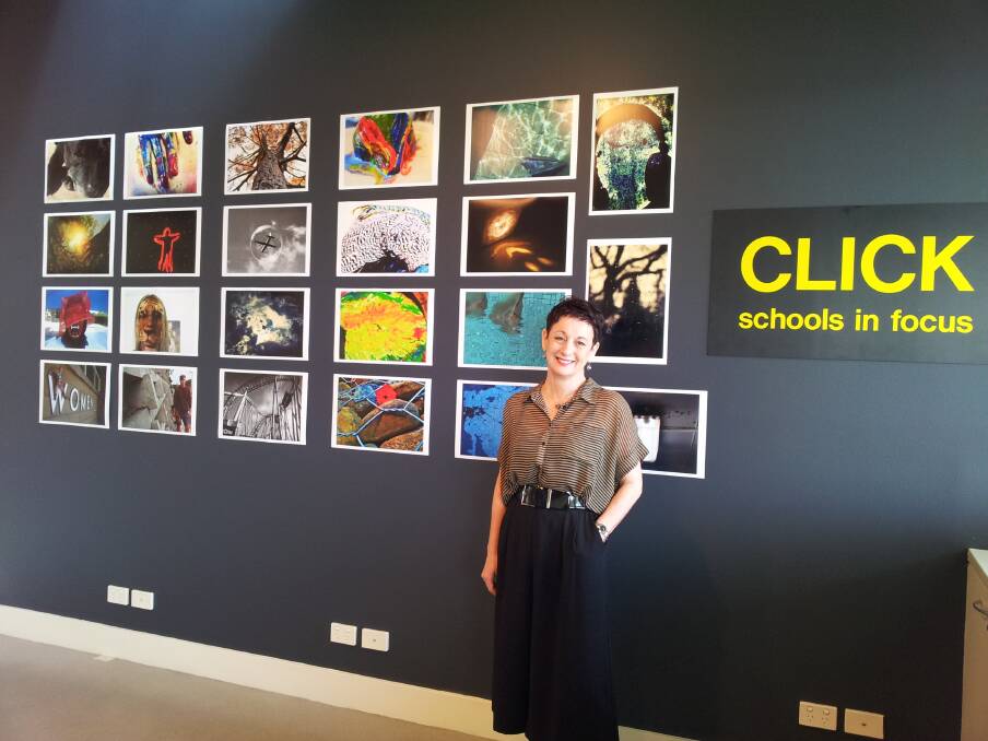 ON REFLECTION: Lake Macquarie City Art Gallery director Debbie Abraham in front of the fourth CLICK: Schools in Focus instalment, by San Clemente High School students.