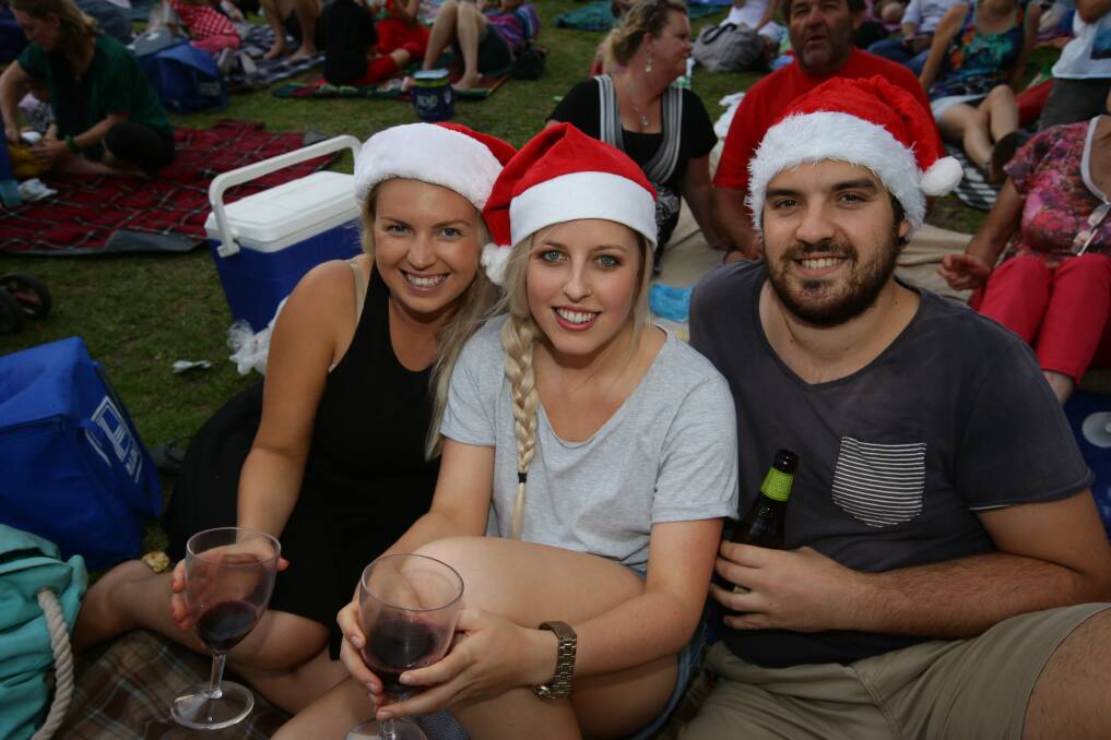 Brittany Ashman, from Whitebridge, with Ruth Clements and Dan Bartel, from Adamstown, at last year's Newcastle Herald Newcastle Permanent Carols By Candlelight, on December 19 this year.