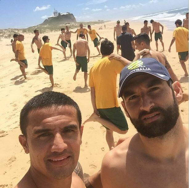 BEACH BOYS: Tim Cahill posted a selfie with captain Mile Jedinal at Nobbys beach on Instagram.