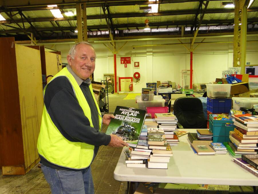 Bookfest volunteer Ross Lane, of Carrington, sorts through the books.