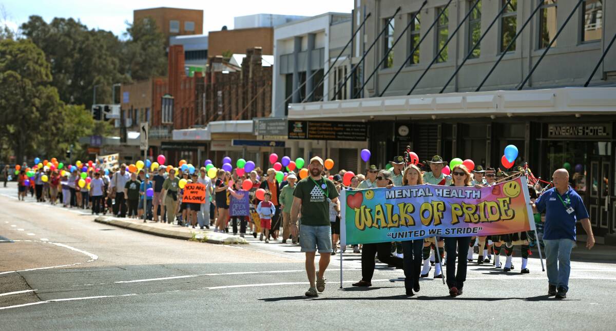 ALONGSIDE: Hundreds of participants in the Mental Health Walk of Pride march through Newcastle on Saturday.