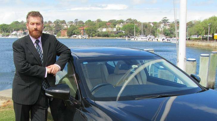 Russell Howarth with his hire car after he carried out his first citizen's arrest. Photo: Supplied
