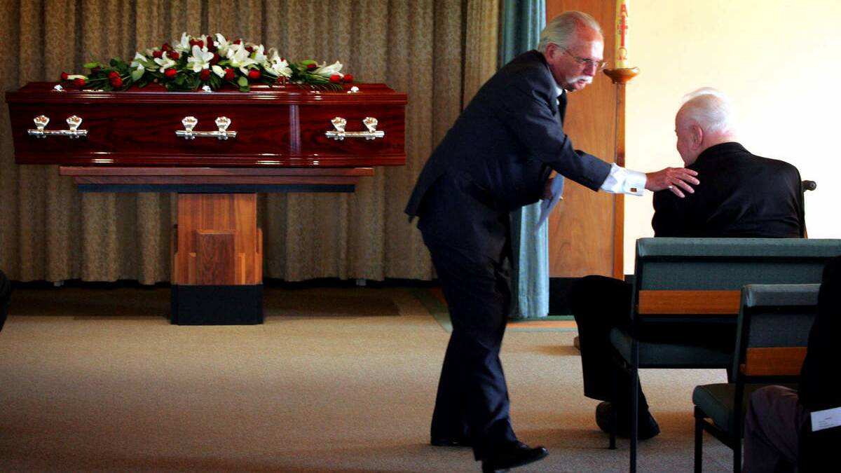 MP Bob Brown comforts former prime minister Gough Whitlam at Bert James’s funeral in 2006