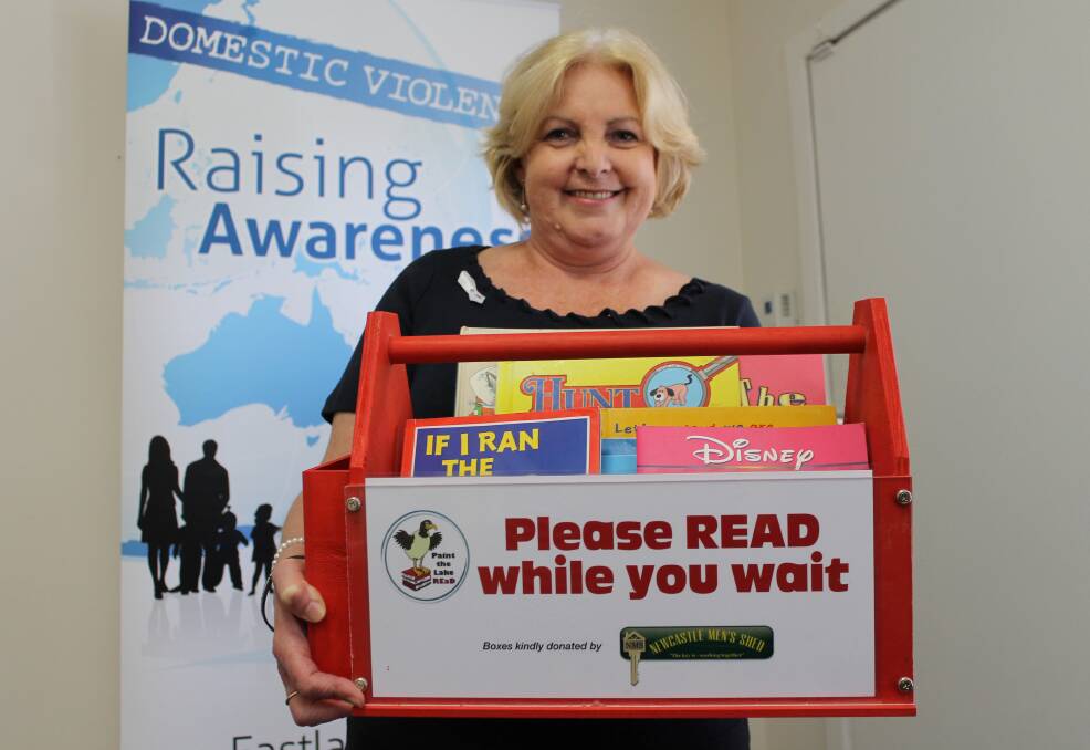 Doing it for the kids: Eastlakes Family Support Service senior family worker Jo Kenning holds the domestic violence committee's first box of donated books.