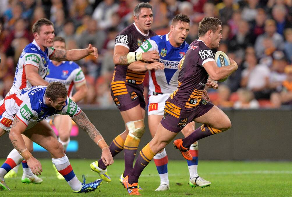 The Newcastle Knights struggle to hold back the Brisbane Broncos. Picture: Getty Images