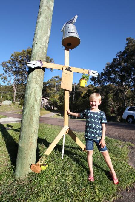 SCARY: Smith Davies, 7, with the scarecrow he created.