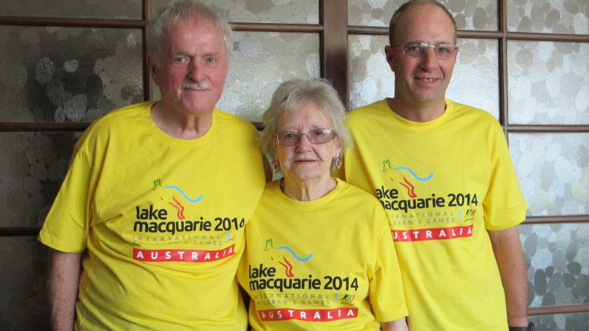 KEEN: 2014 Lake Macquarie International Children’s Games volunteers Phil, Jean and Wayne Hurley.